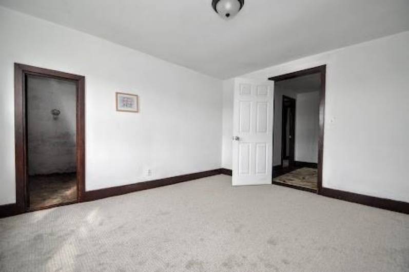 New carpeting is found throughout the house, Here is just one of the carpeted rooms.
