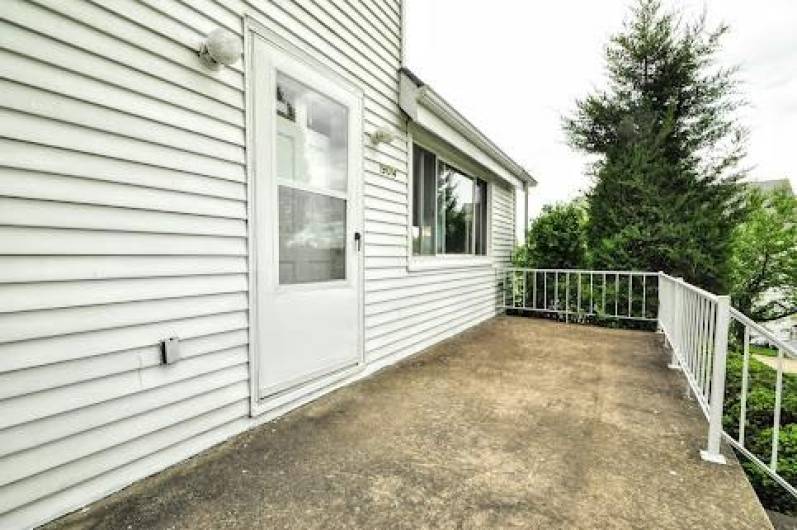 Here is the front porch waiting for summer furniture.