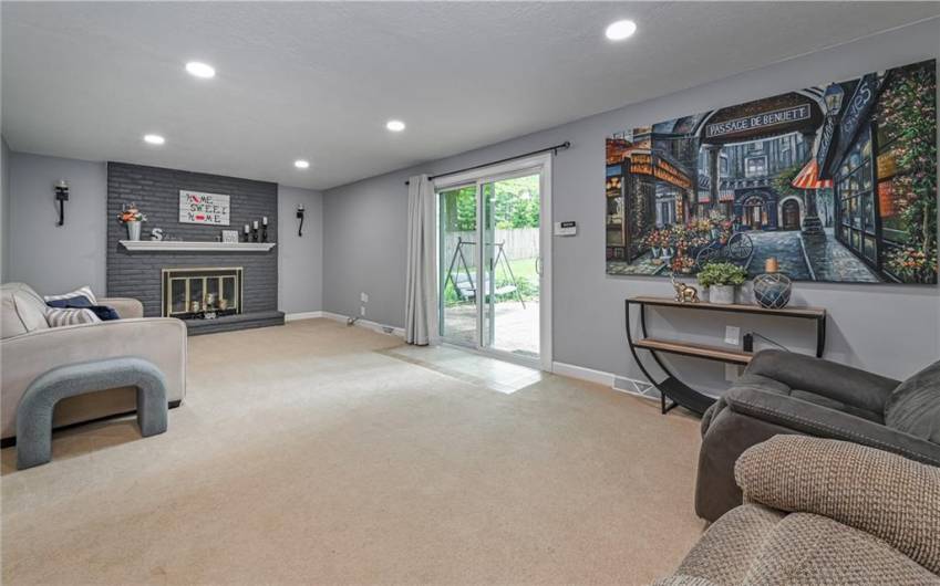 Family room is on entry level and features a cozy gas burning fireplace.