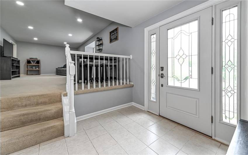 Entry level with three steps into the living room.