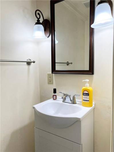 Main level half bath with new vanity.
