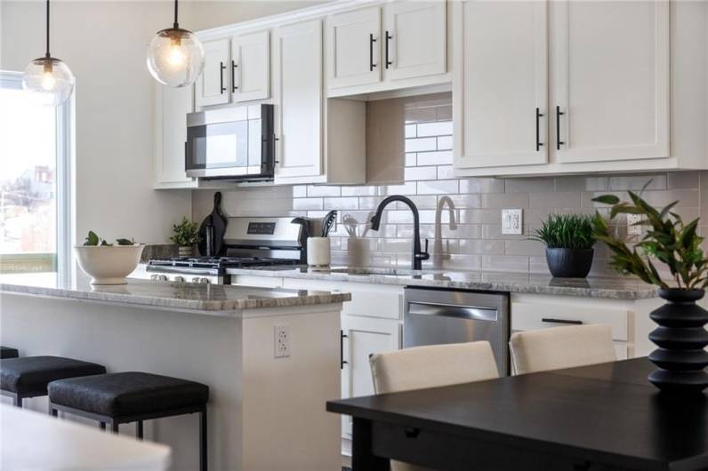 Kitchen *Photo of model home at 21 Rose