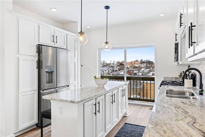 Kitchen *Photo of model home at 21 Rose