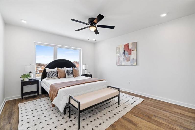 Primary bedroom *Photo of model home at 21 Rose