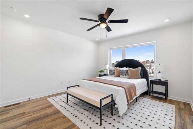 Primary bedroom *Photo of model home at 21 Rose