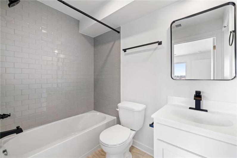Third full bathroom *Photo of model home at 21 Rose