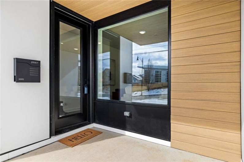 Modern entry with huge picture window which *Photo of model home at 21 Rosefloods the home with natural light!