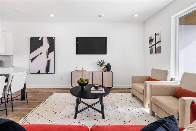 Living room *Photo of model home at 21 Rose
