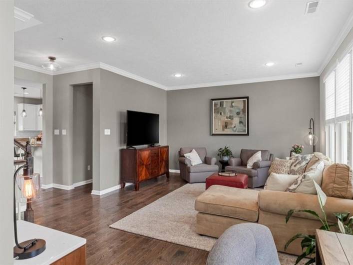 A cozy workspace is tucked into the corner, providing added versatility without compromising flow.
