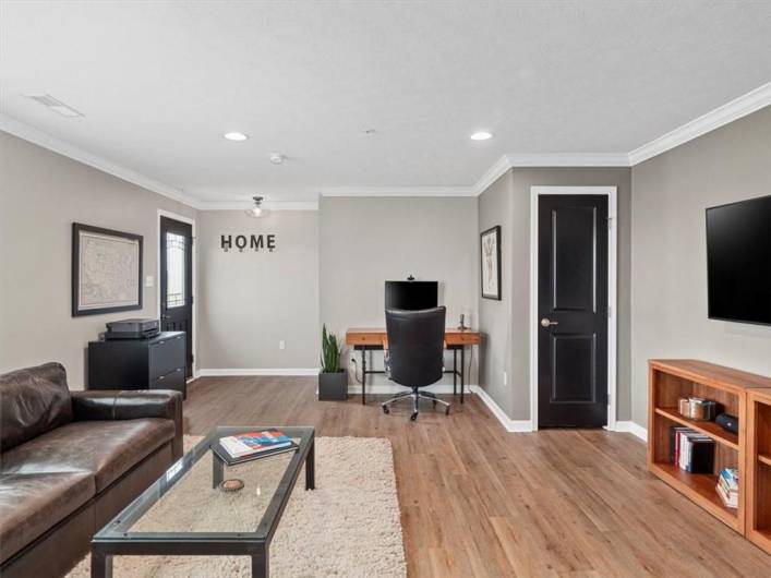 Thoughtfully laid out, the room offers plenty of space for a full seating arrangement, media console, and accent pieces—ideal for everyday living or entertaining. The neutral palette provides a perfect backdrop for any décor style, while clean lines and contemporary finishes elevate the overall aesthetic.