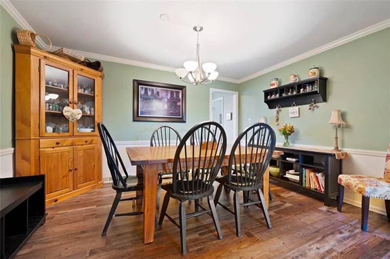 Roomy dining room with easy access to kitchen and living room perfect for entertaining and holiday gatherings