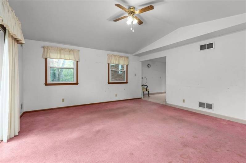 Gather family and friends! The family room has a cathedral ceiling and lighted ceiling fan.