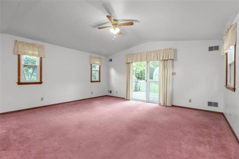 The family room has sliding door access to the rear yard and deck...