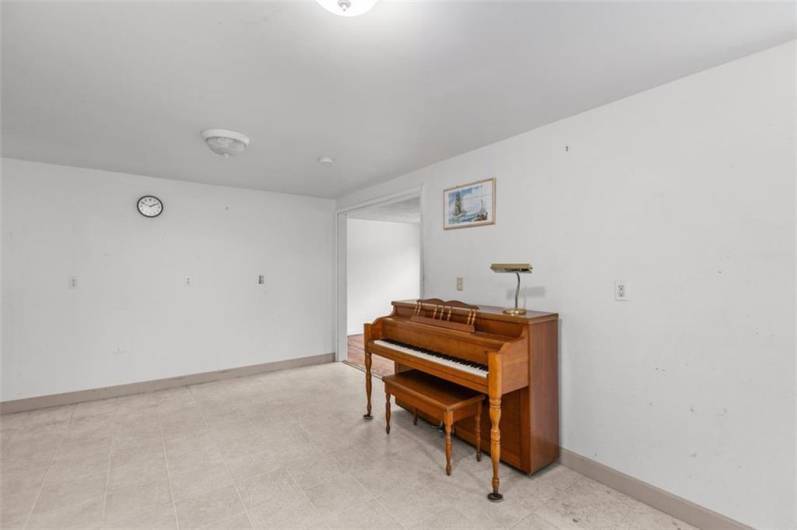 The kitchen offers plenty of space for a LARGE table, even with a piano (LOL)...