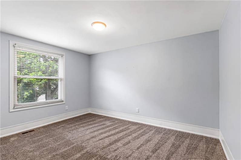 2nd bedroom featuring NEW carpeting.