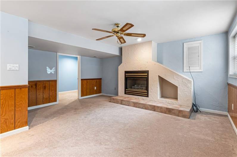 Game room offers a gas fireplace to keep you cozy during winter months.