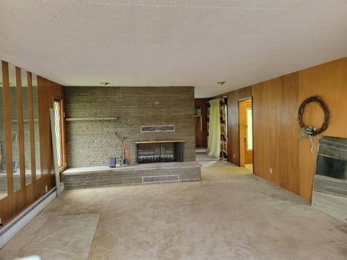 Lovely space w/custom stone 2-side Fireplace