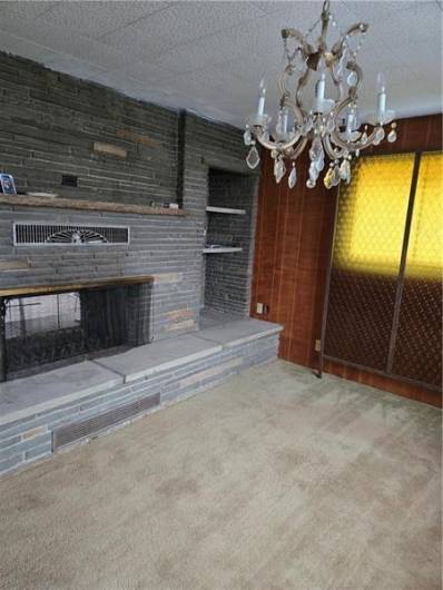 Warm dining room with fireplace & patio access