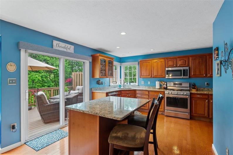 The seller added a kitchen island to face outside to enjoy the private views.  Granite countertops were an upgraded renovation to the kitchen space.