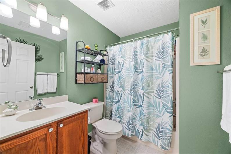 A guest bathroom is located off of the hallway convenient to the 2nd and 3rd bedrooms.
