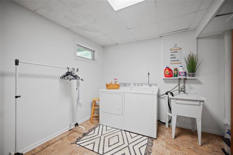Downstairs you will find a designated laundry space with utility sink.   The GE washer and dryer come with the property.