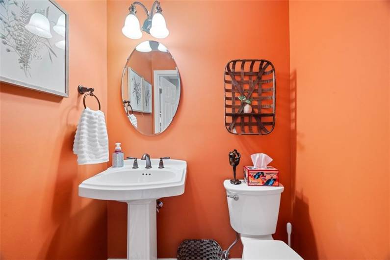 This main floor powder received an upgraded sink and toilet in 2020.
