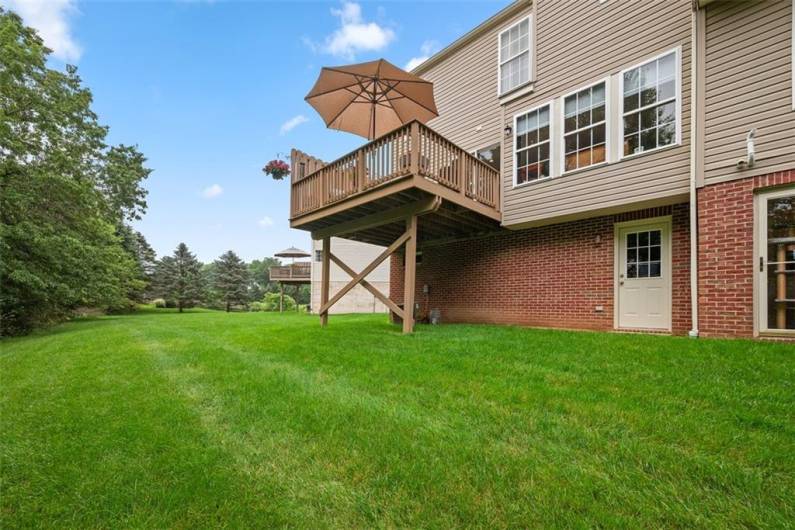 Notice the walk out basement door that leads to the level yard.
