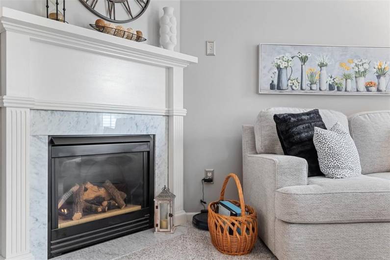 Grab a book and cozy up to the warm gas lit fireplace with marble surround on those cold winter nights.