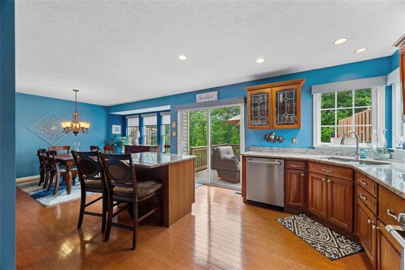 Hardwood floors flow throughout the wide open kitchen space.