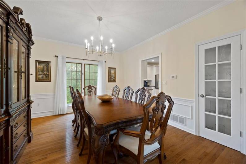 Experience the charm of classic wainscoting and crown molding, turning every dinner into a celebration of love and tradition