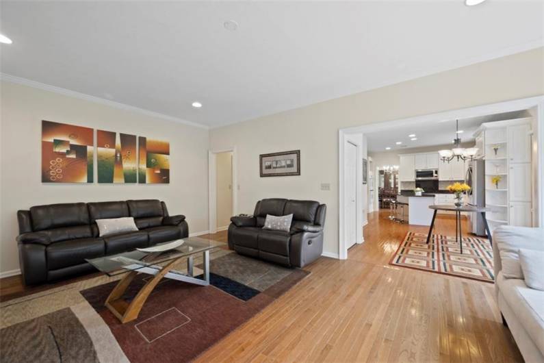 Flow effortlessly from the inviting family room through the bright breakfast nook and gourmet kitchen to the sprawling deck beyond