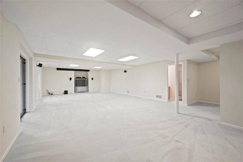The finished lower level offers vast space with walk-out to a charming patio and yard, inviting endless opportunities for leisure and luxury