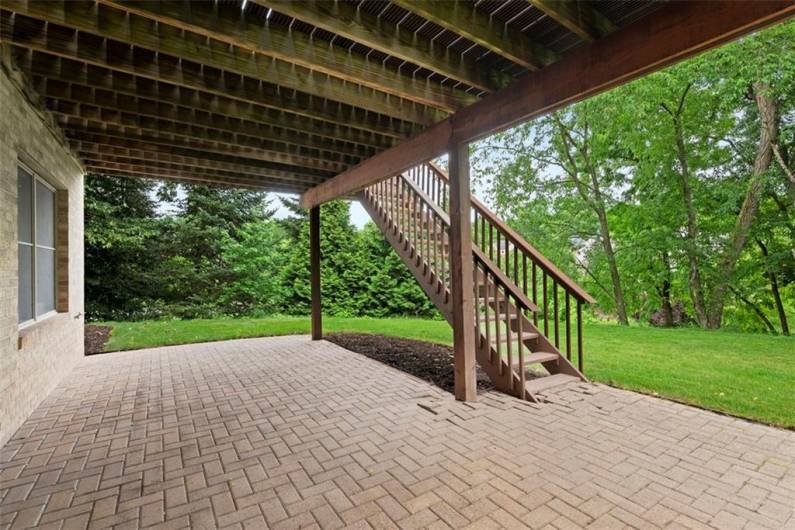 Step down from the deck to a generous lower-level patio, creating a harmonious flow for grand entertaining and relaxation