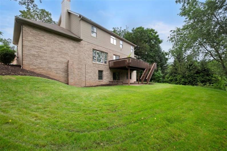 The stunning backyard invites you to unwind and entertain in a private, lush setting that feels worlds away