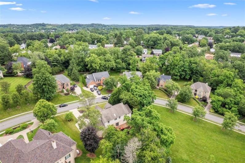A breathtaking aerial glimpse of refined living in the heart of the sought-after Bennington Woods neighborhood