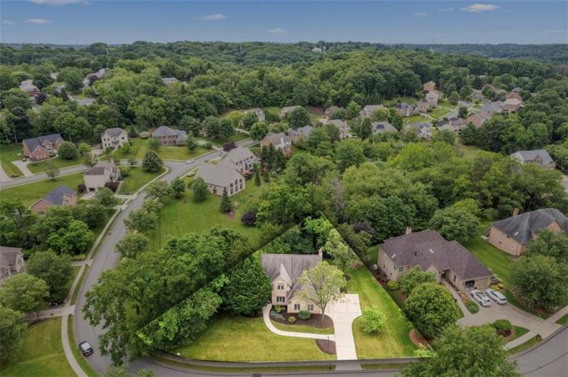 Soar above to admire this impeccable home set within the serene and prestigious Bennington Woods community