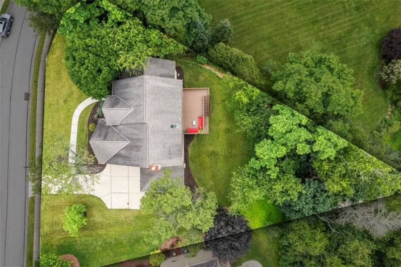 Experience the grandeur of this magnificent home from above, perfectly situated in the exclusive Bennington Woods neighborhood