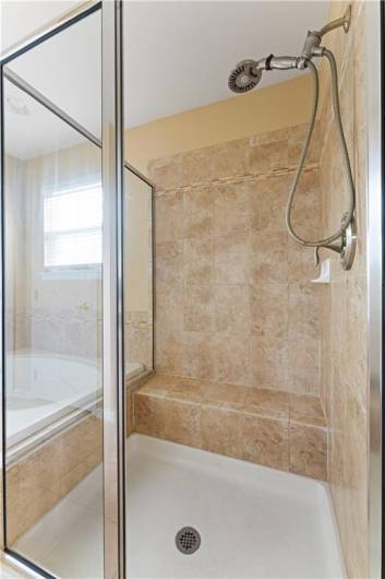 Shower with tile surround.