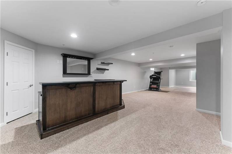 Basement has a dry bar ready to entertain.