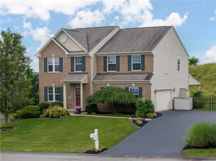 Side entry garage and freshly sealed driveway for plenty of parking.