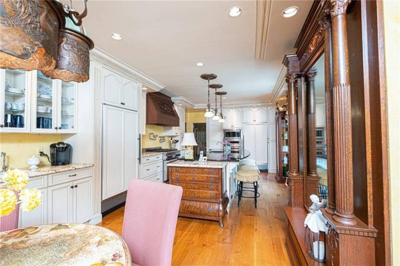 The kitchen, not to be outdone in both charm and function features an 8 foot island, Sub Zero refrigerator and freezer, wall electric oven, microwave and warming drawer. These are just a few gourmet goodies to cook up in this kitchen.