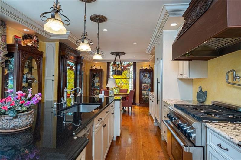 This chefs kitchen also has a pot filler, commercial gas cook top, electric convection oven, and 2 drawer dishwasher along with a large deep sink to handle all of your entertaining.