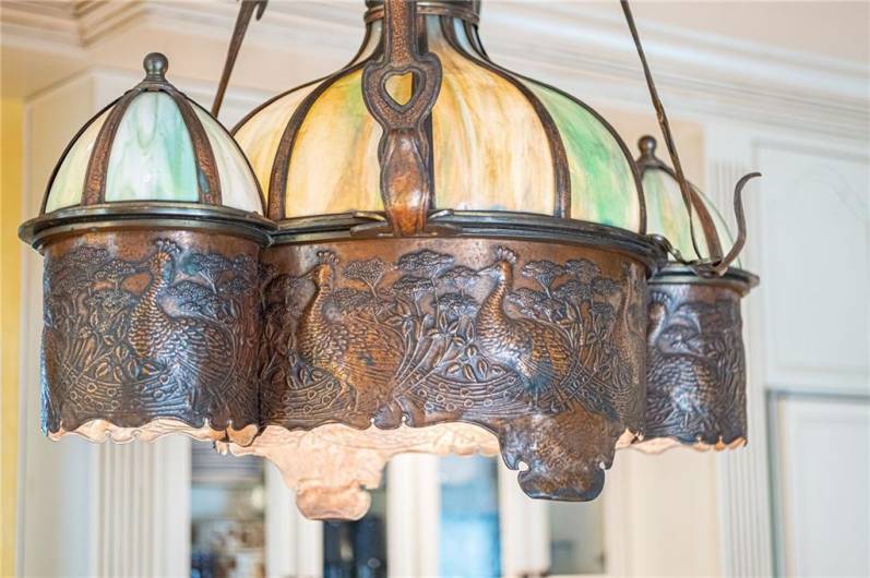 A closer view of the amazing salvaged copper and stained glass light int he breakfast area of kitchen.