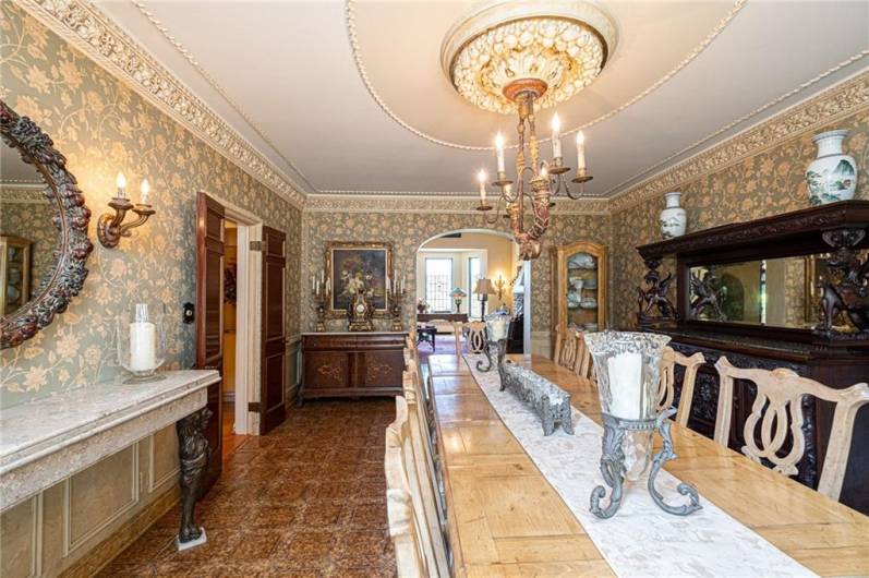 Beautiful antique chandelier anchors room.