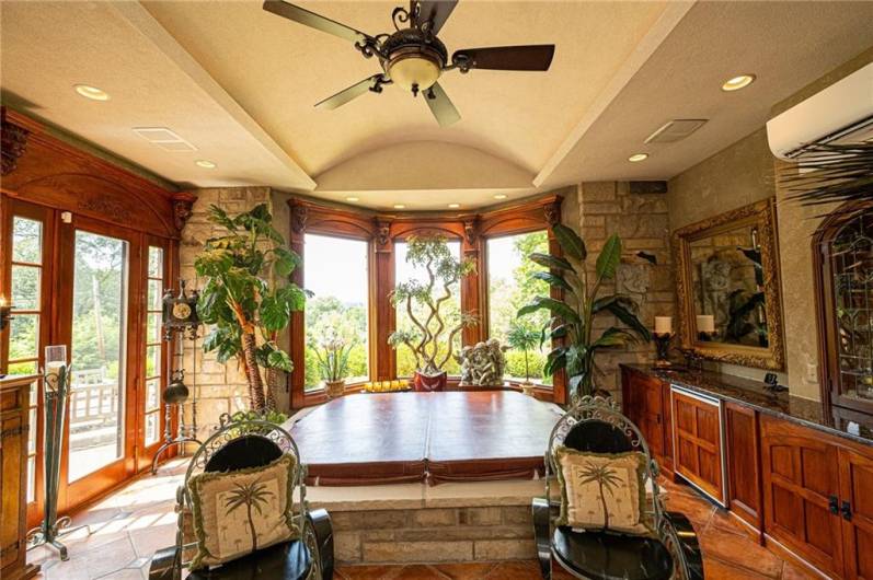 Who does not want a spa room with tons of light. Don't forget the wet bar to the right with a warming drawer for your towels.