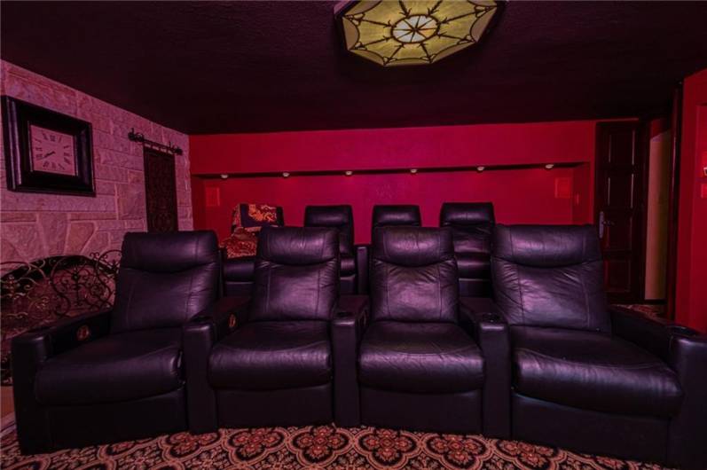 I could definitely watch a movie or two in this room with those comfortable chairs.