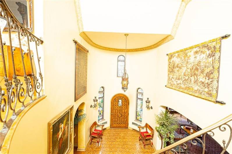 Soaring 2 story entry complete with stained glass windows.