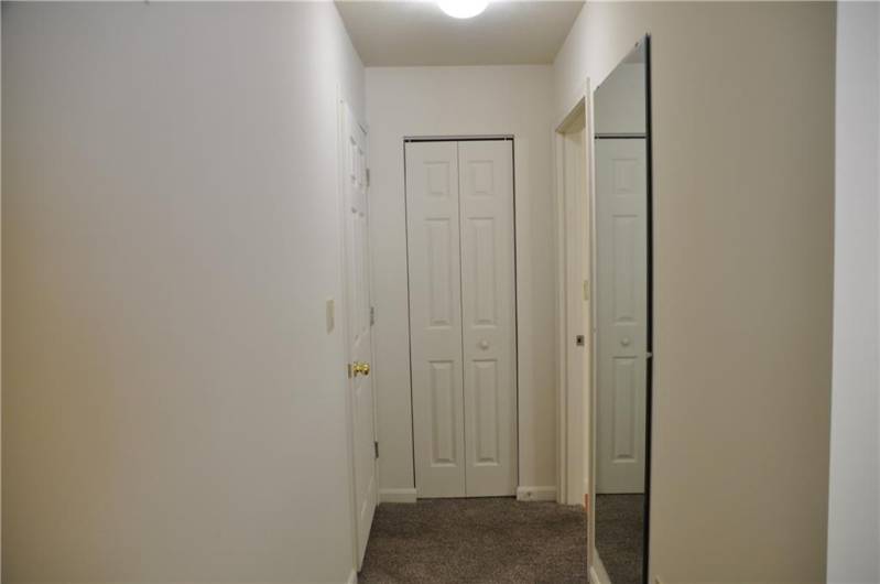 Hallway from bedroom to private bathroom.
