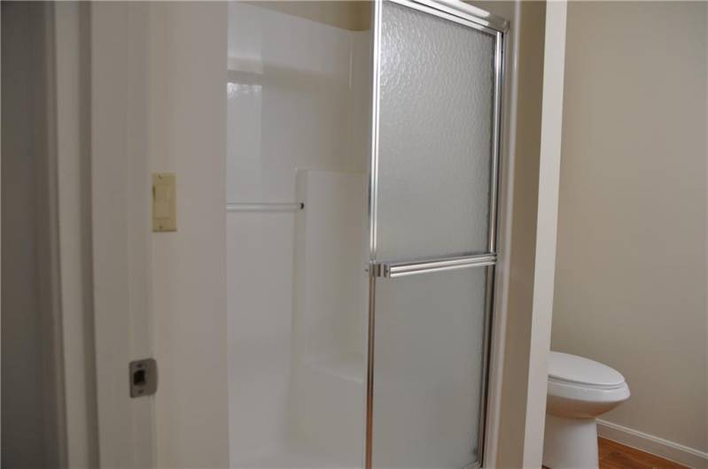 Large shower with seat.
