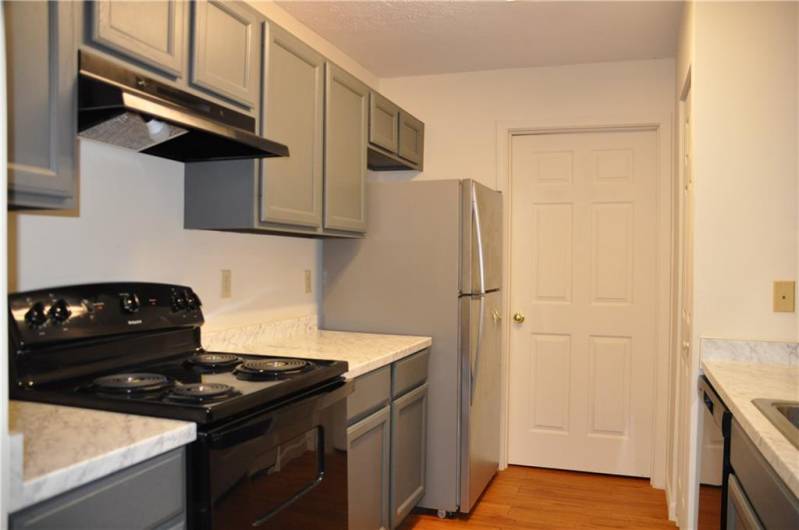 Updated kitchen with stainless and black appliances and newer counters. A pantry for extra storage!
